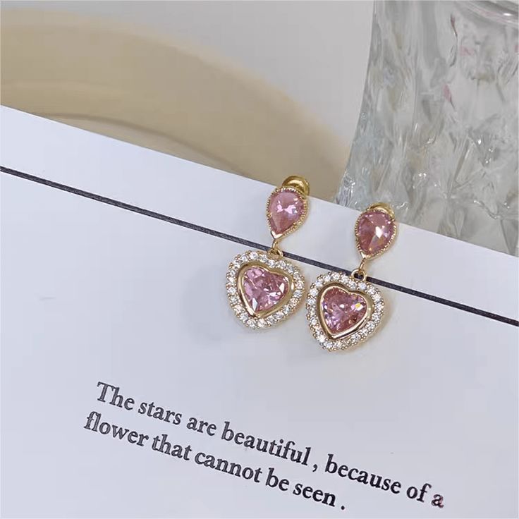 Description:Crystal Dangling Heart Earrings Specifications: Material: S925 silver, Copper, Cubic Zirconia, RhinestoneColors: PinkSize: 3 cm * 1.5 cmWeight: 6.8 g/pair "Add some sparkle to your style with these Crystal Dangling Heart Earrings! Perfect for a night out or a special occasion, these earrings will catch everyone's eye and make you stand out. 💎❤️" Blowout Sale, Enamel Bracelet, Different Outfits, Exquisite Jewelry, Pink Crystal, Heart Earrings, Heart Design, Costume Party, Crystal Earrings