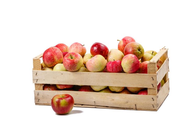 a wooden crate filled with lots of red and yellow apples on top of each other