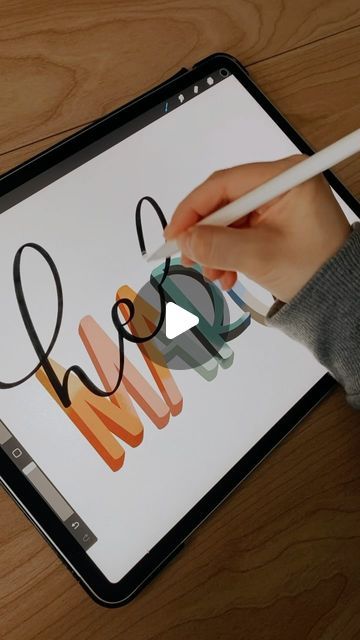 a person is using an ipad to draw the word mom on it with pencils