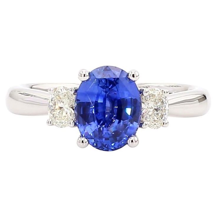 an oval blue sapphire and diamond ring