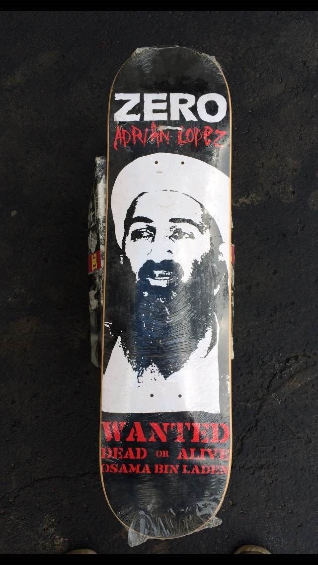 a skateboard with an image of a bearded man on it's bottom half