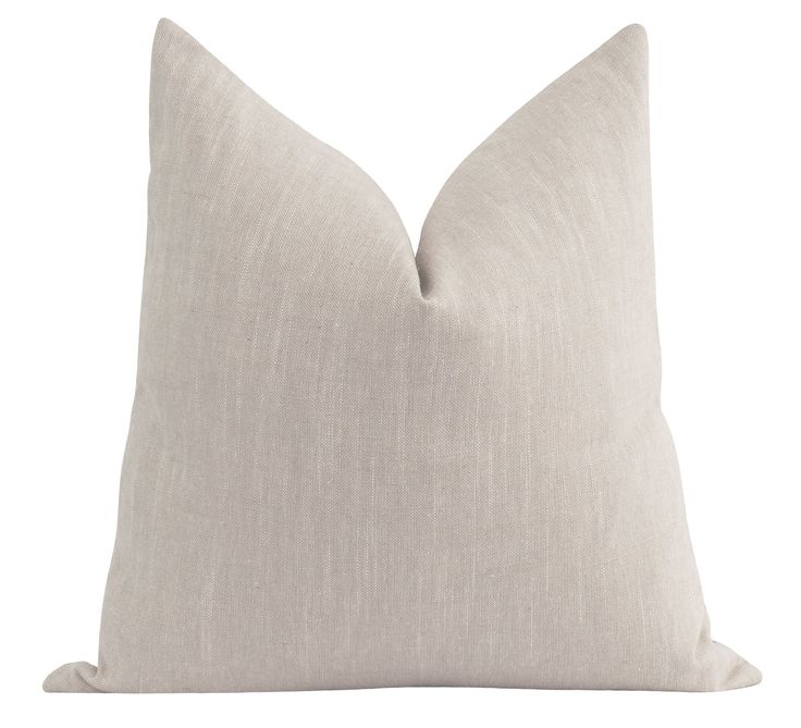 a white pillow on a white background with a light colored linen back and side that is slightly down