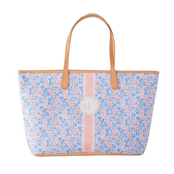 a blue and pink floral tote bag with the letter d on it's side