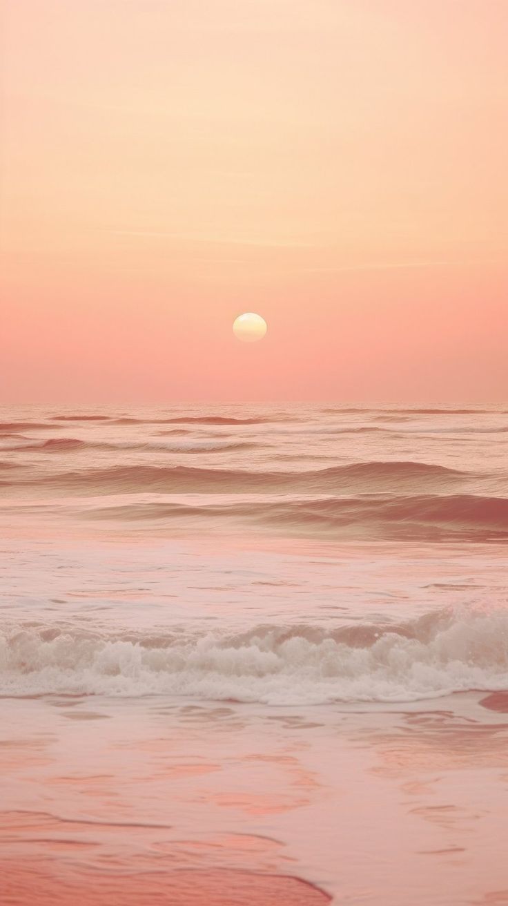 the sun is setting over the ocean with waves