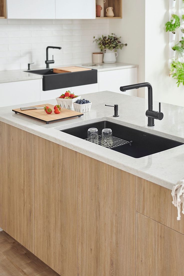 a kitchen counter with a sink and cutting board on it