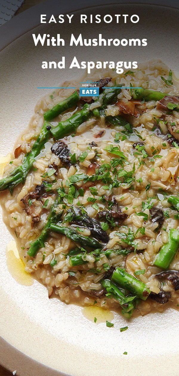 a white plate topped with rice and asparagus