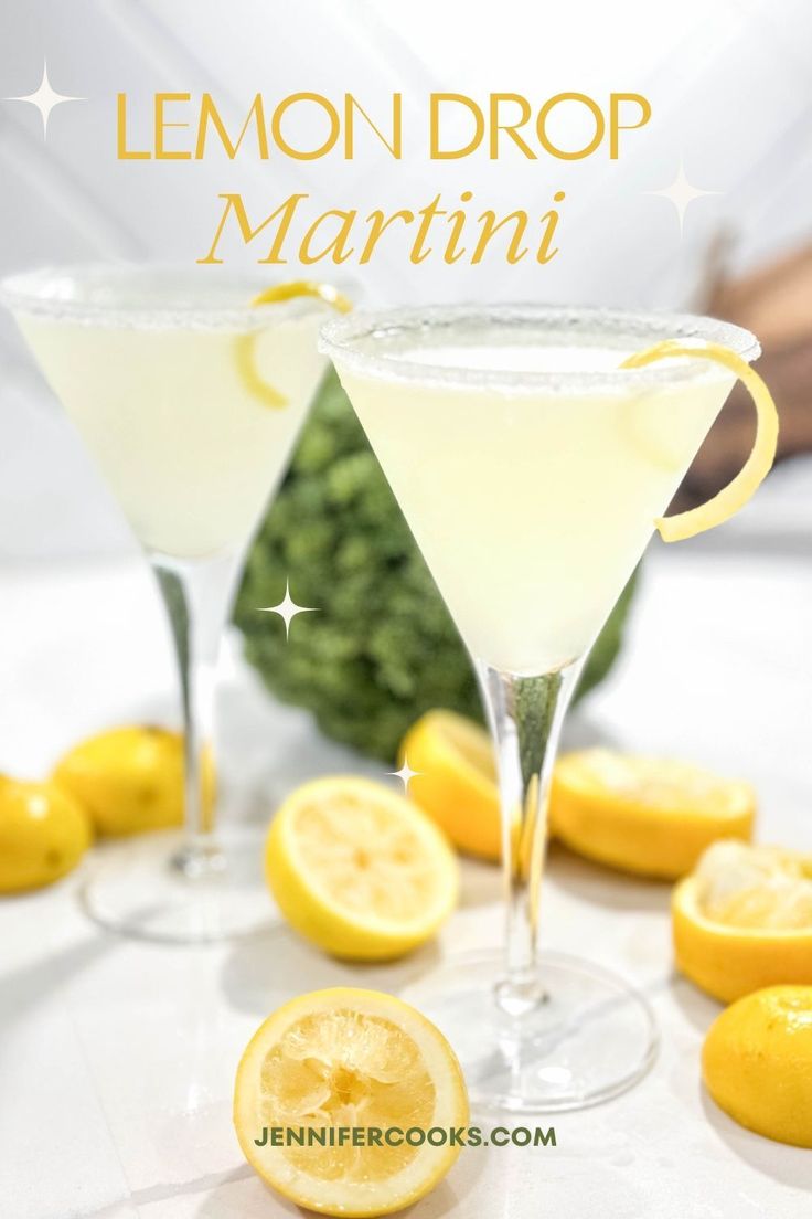 two lemon drop martinis sitting on top of a table