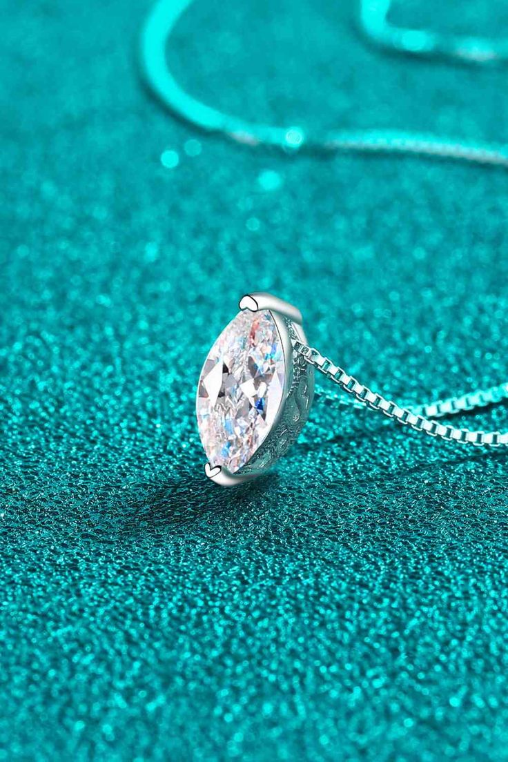 The Aurora Adorn: 1-Carat Moissanite Necklace is a stunning and timeless piece of jewelry. Featuring a shimmering 1-carat moissanite stone, this necklace is sure to catch the eye and elevate any outfit. Crafted with expert precision and quality materials, it is the perfect addition to any collection. Description Elevate your style with our exquisite Moissanite jewelry, packaged in a matching box and accompanied by a certificate of stone properties. Enjoy the added assurance of a limited warranty Moissanite Pendant Necklace With Diamond Cut, Solitaire Lab Grown Diamond Necklace For Gift, Moissanite Diamond Cut Pendant Necklace, Dazzling Solitaire Pendant Jewelry, Diamond Cut Moissanite Necklace In Diamond White, Diamond White Moissanite Necklace With Diamond Cut, Dazzling Solitaire Necklace In Diamond White, Dazzling Solitaire Sterling Silver Necklace, Moissanite Solitaire Necklace For Gifting