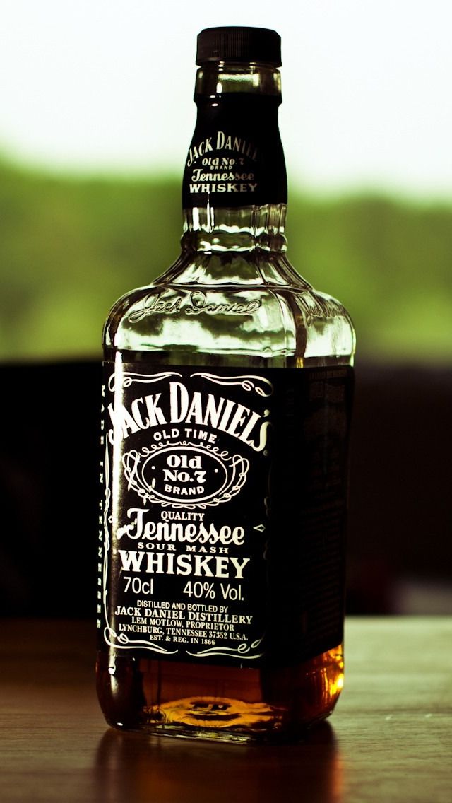 a bottle of jack daniels whiskey sitting on a table