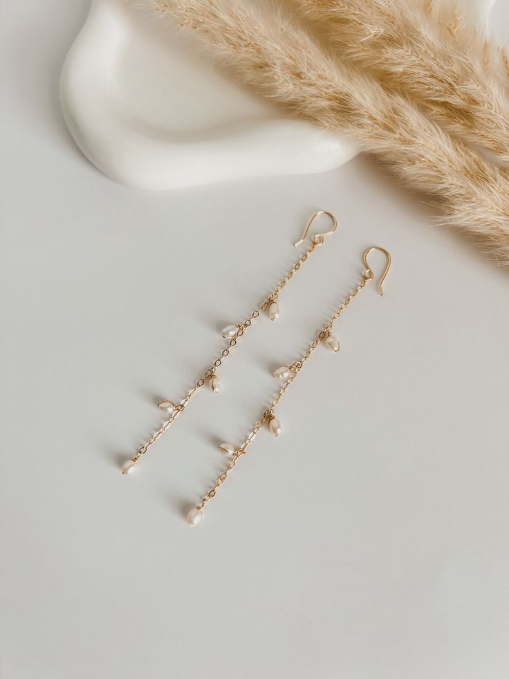 Long, elegant and delicate earrings, carefully handmade with natural rice-type pearls, wire and chain filled with 14K gold. Easy to use, perfect for an elegant style, wedding, or for everyday use. Ideal gift for women. Durable. Length 4 Inch Rice Types, Natural Pearl Earrings, Earrings Elegant, Natural Pearl, Delicate Earrings, Style Wedding, Elegant Earrings, Natural Pearls, Elegant Style