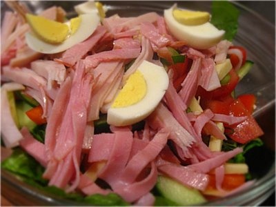 a close up of a plate of food with meat and veggies