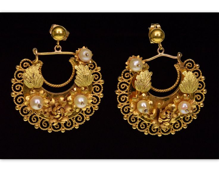 Amazing Victorian 2-tone gold Etruscan revival dangle earring C.1860. The earrings designed as crescents with elaborate filigree work. They are embellished with 3-D flowers, carved yellow gold leaves, and wired pearls. There is a lot of movement on the crescent dangles. The earrings are 37 mm tall, 30 mm wide. They are tested 14K gold, the butterfly nuts stamped 14K.. Total weight is 9 grams. Excellent antique condition commensurate with age. Historical Yellow Gold Drop Earrings, Yellow Gold Historical Drop Earrings, Yellow Gold Drop Earrings With Historical Design, Antique Earrings With Historical Design For Ceremonial Occasions, Antique Yellow Gold Ceremonial Earrings, Antique Yellow Gold Earrings For Wedding, Antique Yellow Gold Wedding Earrings, Victorian Hallmarked Jewelry For Opera, Victorian Style Ceremonial Earrings For Pierced Ears