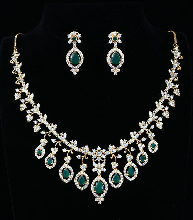 This exquisite Mothers Day Gift necklace showcases a charming South Indian-style gold floral design, featuring ruby and emerald stones. Intricately handcrafted, this statement jewelry will add a beautiful touch to wedding or special occasion outfit. Occasion Outfit, Indian Wedding Jewelry, Special Occasion Outfits, Kundan Necklaces, Cz Jewelry, Emerald Stone, American Diamond, Indian Style, Gold Floral