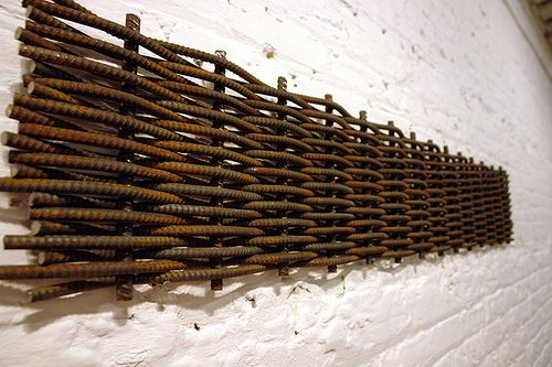 there is a wall made out of rusty nails