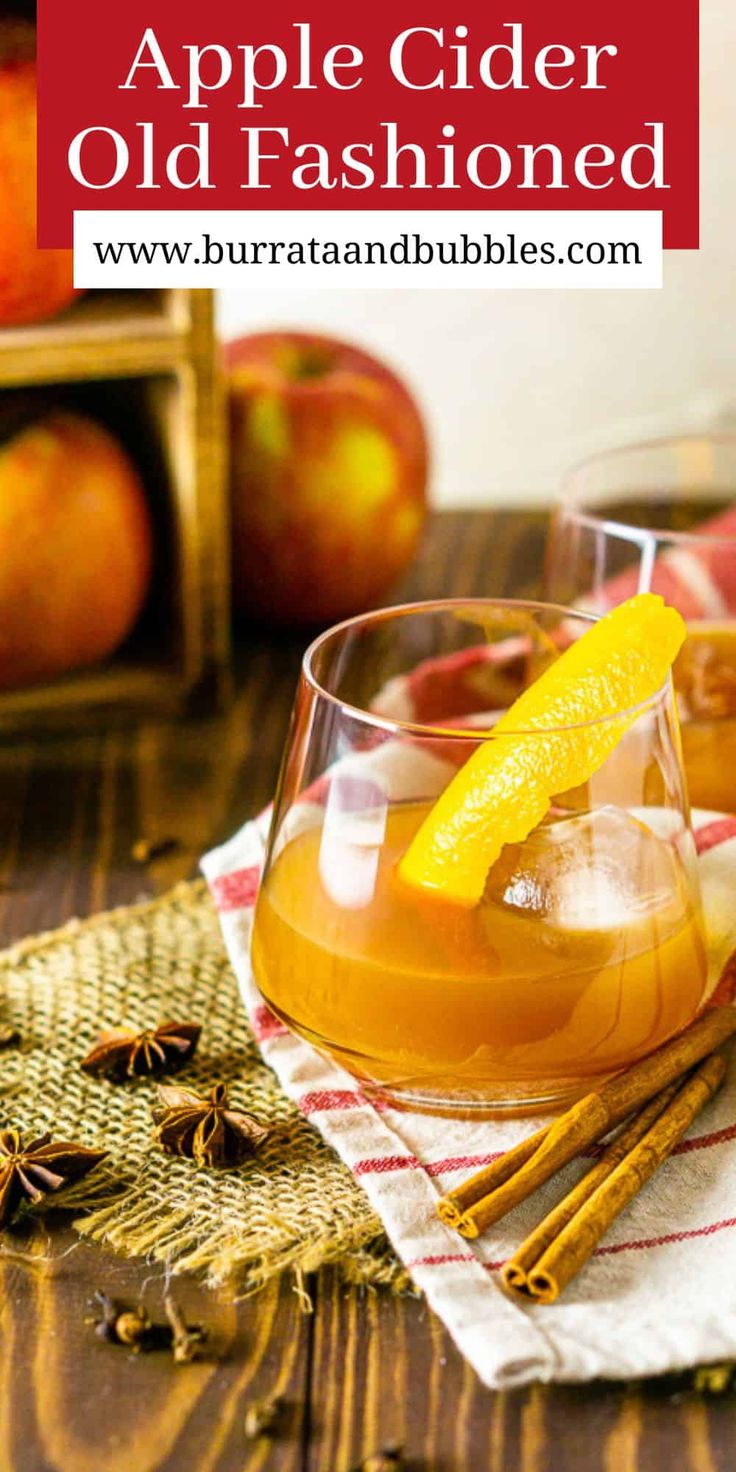 an old fashioned apple cider is garnished with orange slices