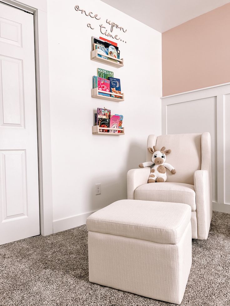 a white chair with a stuffed animal sitting on it's back in a room