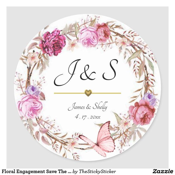 a round wedding sticker with pink flowers and butterflies on the front, says j & s