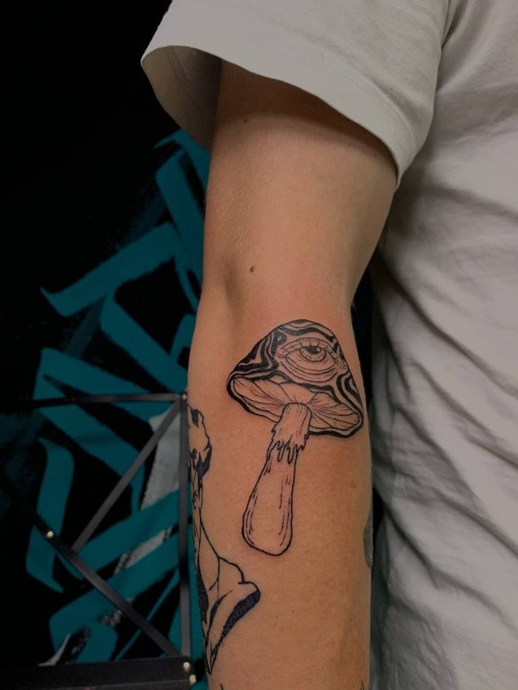 a person with a tattoo on their arm