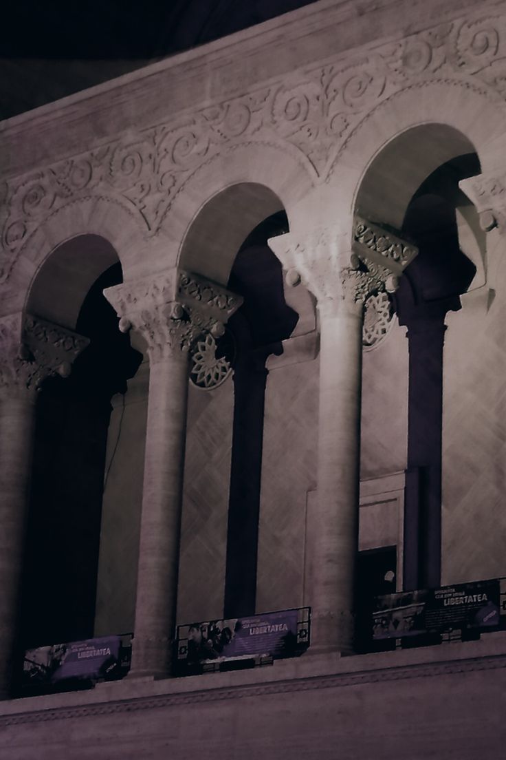 an ornate building with columns and arches