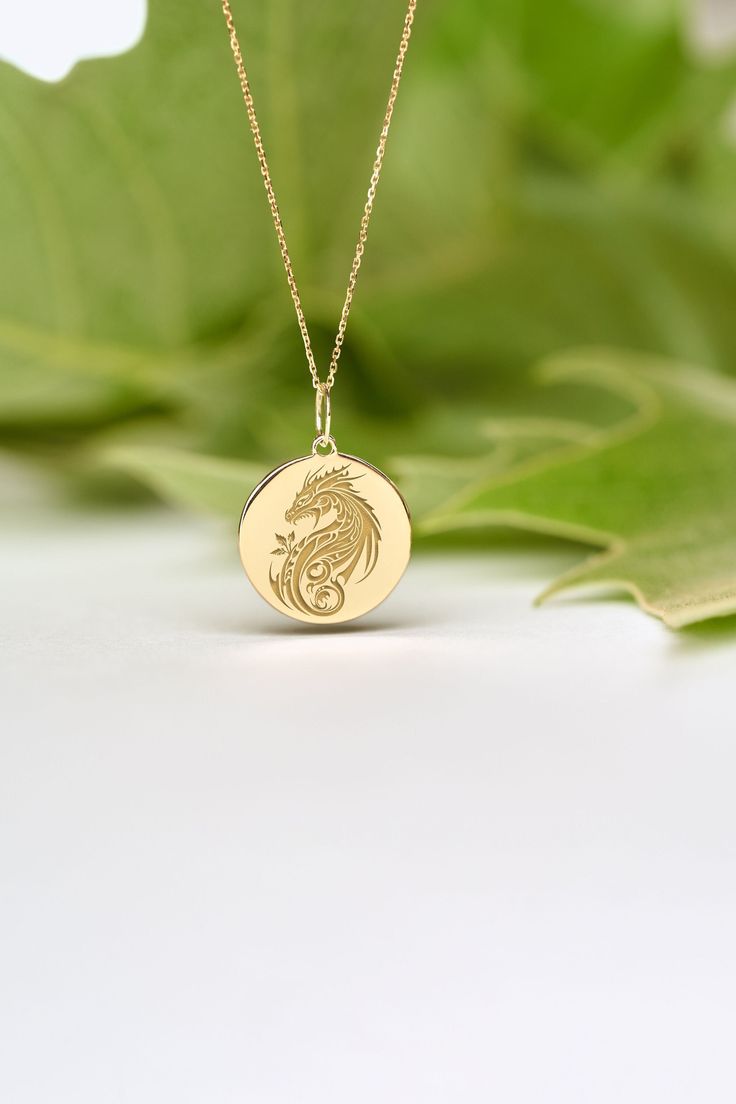 If you wish we can personalize your 14k Solid Gold Dragon Necklace. A Dainty and unique gift for Birthdays, Graduations, Weddings and Anniversaries. ● MATERIAL 14k SOLID GOLD ● Chain Length or Without Chain - Without Chain - 40 cm / 16 inches - 45 cm / 18 inches - 50 cm / 20 inches ● PENDANT SIZE [The jump ring (bail) is not included in the measurements] - 13 mm / 0.51 Inches diameter - 14 mm / 0.55 Inches diameter - 15.3mm / 0.6 Inches diameter - 16.5mm / 0.65 Inches diameter - 19 mm / 0.75 Inc Customizable 14k Gold Necklace As A Gift, Symbolic 14k Gold Jewelry With Engraving Option, Symbolic Yellow Gold Jewelry With Engraving Option, Spiritual 14k Gold Personalized Charm Necklaces, Personalized 14k Gold Spiritual Charm Necklaces, Personalized 14k Gold Spiritual Charm Necklace, Customizable 14k Gold Charm Necklaces For Anniversary, Customizable 14k Gold Pendant Jewelry, Symbolic Engraved Jewelry For Anniversary