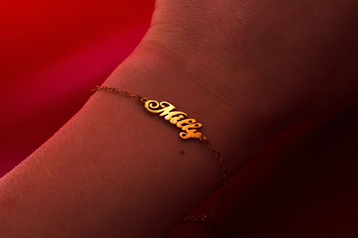 This personalized name bracelet, made of 14k gold, is a perfect dainty gift for mom. Ideal as a personalized jewelry birthday gift, this elegant name bracelet adds a touch of sophistication to any occasion. 𝐃𝐄𝐓𝐀𝐈𝐋𝐒 💎 1 name bracelet, included 💎 Material: 14k Solid Gold  💎 Length: Small, Medium or Large 💎 Finish: Polished 𝐇𝐎𝐖 𝐓𝐎 𝐎𝐑𝐃𝐄𝐑 1. In the "Personalization Field", enter the name to be engraved 2. Select the bracelet length 4. Select desired shipping method  𝐘𝐎𝐔 𝐌𝐈𝐆𝐇𝐓 𝐀𝐋𝐒𝐎 𝐋𝐈𝐊𝐄 💎 https://www.etsy.com/shop/RUMJewelry?section_id=47032677 💎 https://www.etsy.com/listing/755198568/evil-eye-ring-gold-evil-eye-ring-with?click_key=7f668b2e02e1e4fc060be1fd5285cbac38f836bb%3A755198568&click_sum=463ed137&ref=shop_home_active_42&pro=1&frs=1 𝐒𝐇𝐈𝐏𝐏𝐈𝐍𝐆 Sh Custom Name 14k Yellow Gold Bracelet, 14k Gold Name Bracelet For Anniversary, 14k Gold Nameplate Bracelet For Anniversary, Custom Name 14k Gold Dainty Bracelet, Dainty 14k Gold Custom Name Bracelet, Personalized Nameplate Bracelet In 14k Gold, Personalized 14k Gold Nameplate Bracelet, Customizable Yellow Gold Name Bracelet Gift, Personalized Yellow Gold Nameplate Bracelet