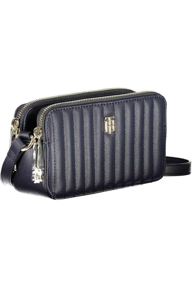 Dive into the world of modern luxury with this exquisite Tommy Hilfiger adjustable shoulder bag. Perfectly crafted to carry your essentials in sleek style, this bag features two spacious compartments, a nifty central pocket, and an additional internal card pocket for seamless organization. Adorned with eye-catching contrasting details and secured with both zip and automatic closure, this statement piece is finished with the iconic Tommy Hilfiger logo. An undeniable blend of fashion and function. Tommy Hilfiger Logo, Women Handbag, Sleek Fashion, Calvin Klein Black, Leather Clutch, Leather Accessories, Blue Leather, Satchel Bags, Modern Luxury