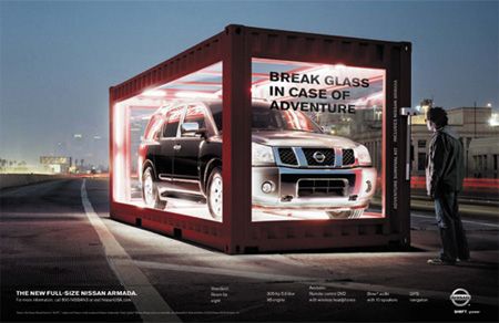 a man standing in front of a large container with two cars on it and the words break glass in case of adventure