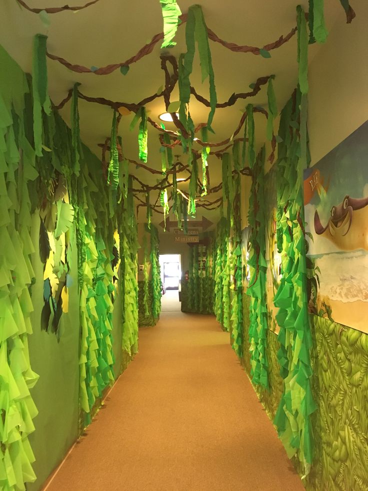 the hallway is decorated with green paper trees