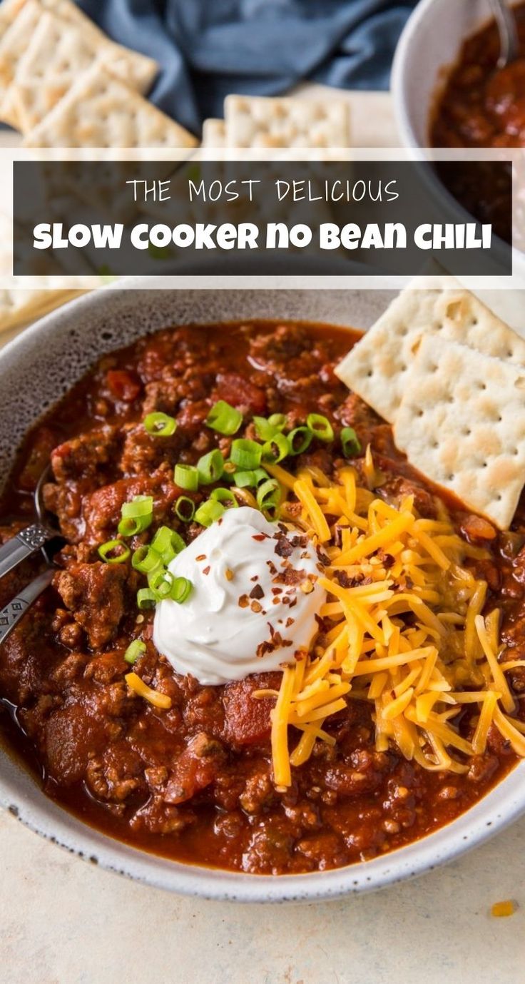 a bowl filled with chili and cheese next to crackers on the side text reads the fastest slow cooker no bean chili