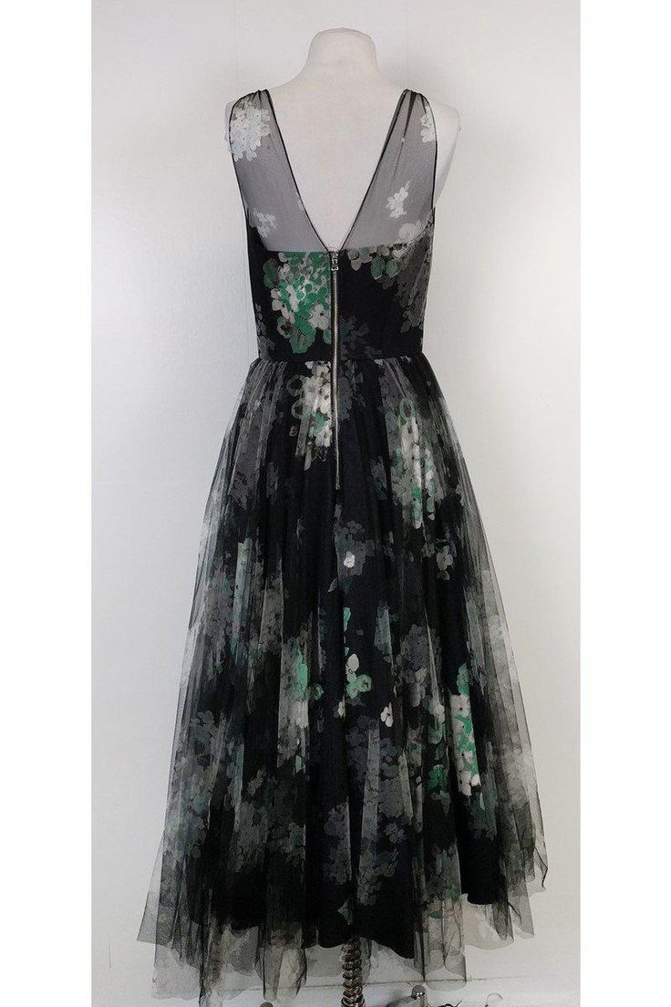 Feel like a glamorous star in this feminine gown. Sweet floral print surrounds the mesh overlay fabric. Its full skirt will complement your figure. Add silver jewelry and shoes for a touch of sparkle. Size 8 58% cotton, 42% viscose Made in U.SA. of imported fabric Sweetheart neckline Floral print - black, green & white Mesh overlay fabric Lined Full skirt Fitted at waist Back zipper Bust 34.5" Waist 28.5" Shoulder to hem 49.5" Green Floral Gown, Floral Gown, Buy Shoes Online, Mesh Overlay, Skirt Fits, Sweet Floral, White Mesh, Contemporary Fashion, Creative Fashion