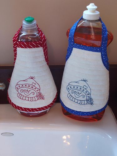 two water bottles sitting on top of a sink