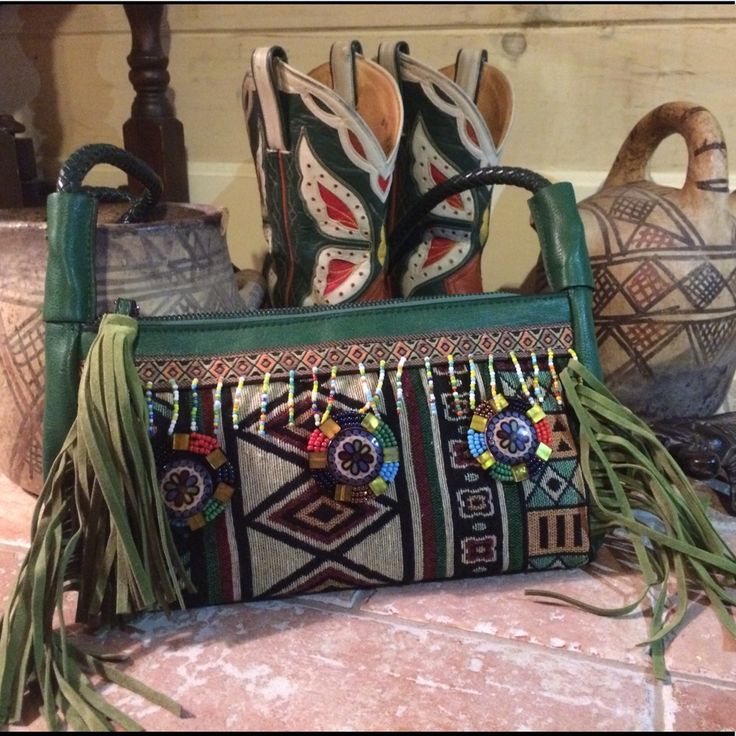 47 Inch Cross Body Strap, Zip Main Closer, Interior Zip Pocket And Two Slip Pockets. Hand Beaded With Fringe! 12 X 2.5 X 6 Green Bohemian Clutch For Everyday Use, Bohemian Bags With Leather Trim, Bohemian Hand-stitched Leather Bags, Southwestern Style Bag With Adjustable Strap, Bohemian Hand-stitched Crossbody Satchel, Bohemian Fringe Crossbody Satchel, Cross Body Handbag, Tooled Leather Bag, Tooled Leather