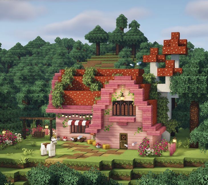 an image of a pink house in the middle of some trees and bushes with flowers on it