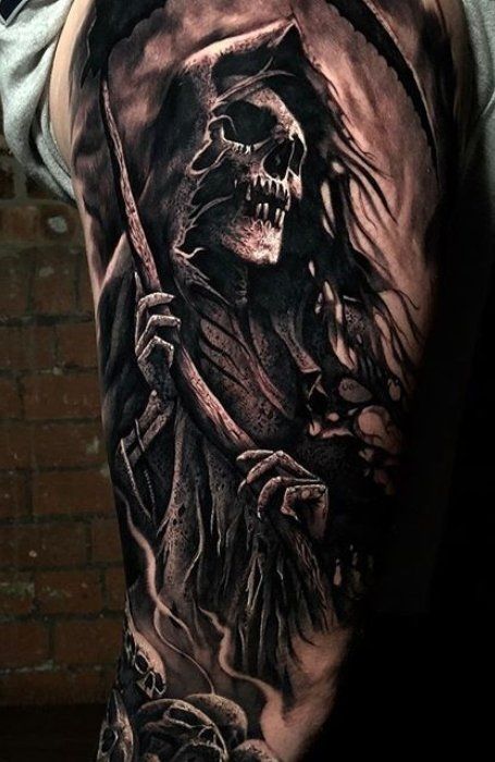 a man's half sleeve with a skull and grime on the arm, holding a