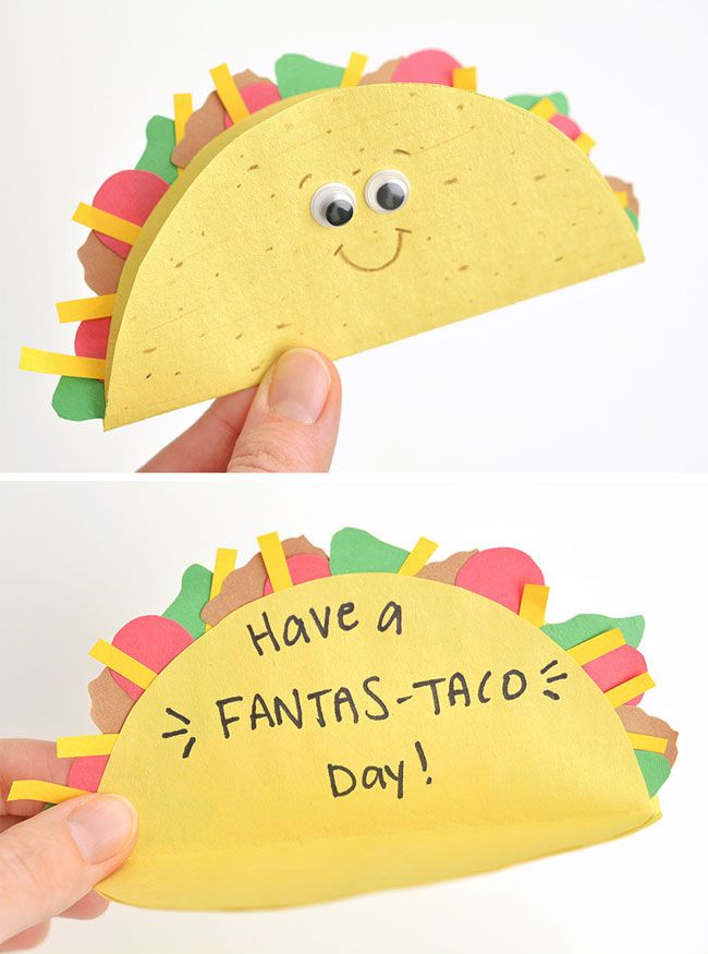 a hand holding up a paper taco with the words have a fantas - taco day written on it