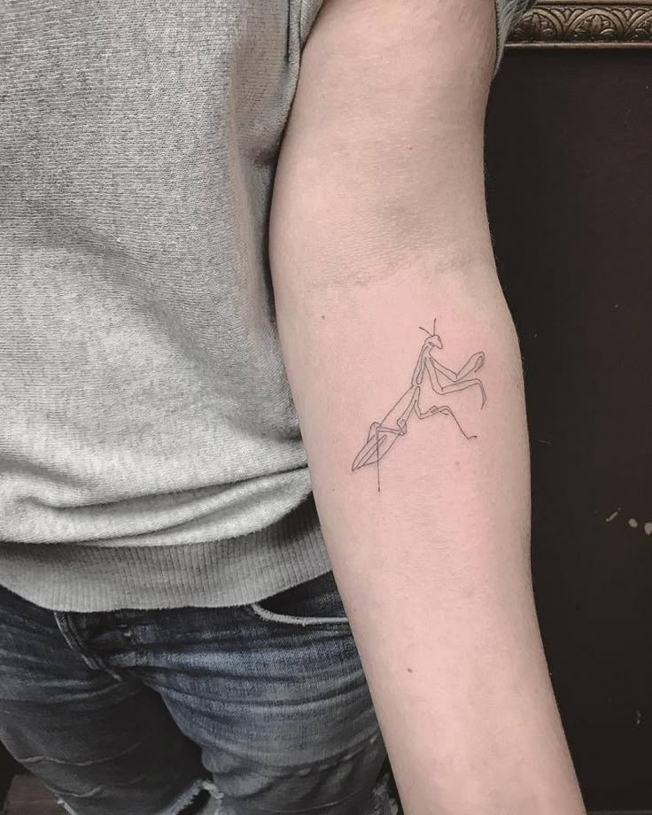 a person with a small tattoo on their arm