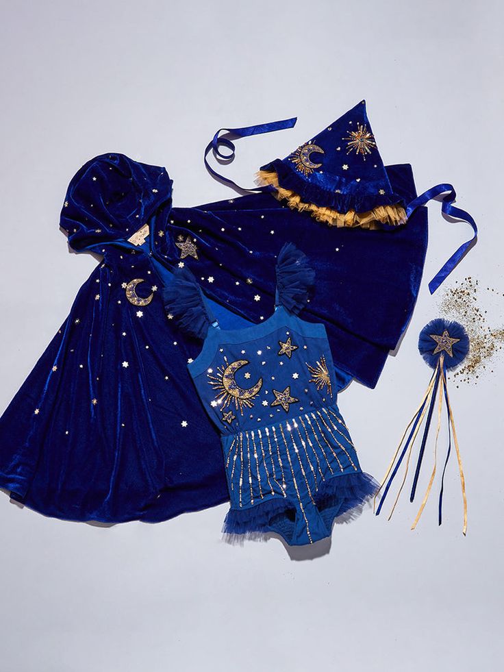 a blue dress and matching hat are on display in the sky, with other items attached to it