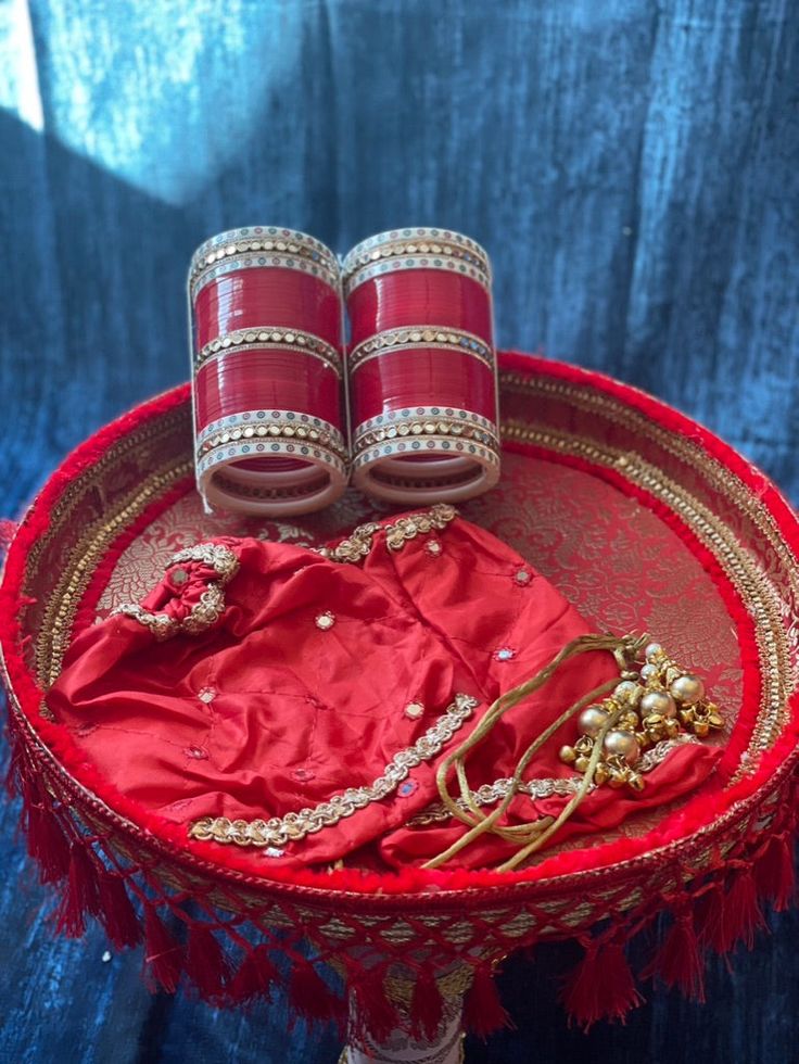 Cover your Choora for the big day with these simpler choora covers. Made with soft silk material, mirror work design, gotta border work, and beaded latkans. One size. Available in pink, red, rani pink, peach, and light gold. Pink Kundan Dupatta For Traditional Ceremonies, Pink Traditional Wear With Gota Work For Festive Occasion, Festive Pink Traditional Wear With Gota Work, Pink Kundan Saree For Festivals, Pink Kundan Choli For Traditional Ceremonies, Red Traditional Wear With Mirror Work In Dola Silk, Red Dola Silk Traditional Wear With Mirror Work, Red Traditional Wear In Dola Silk With Mirror Work, Pink Silk Thread Sets For Festivals