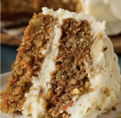 a slice of carrot cake on a white plate