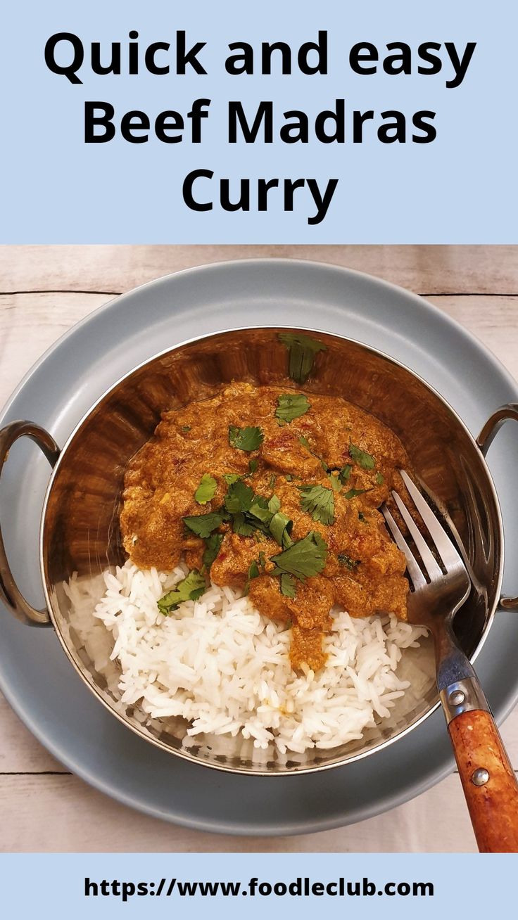 a bowl filled with rice and meat next to a fork