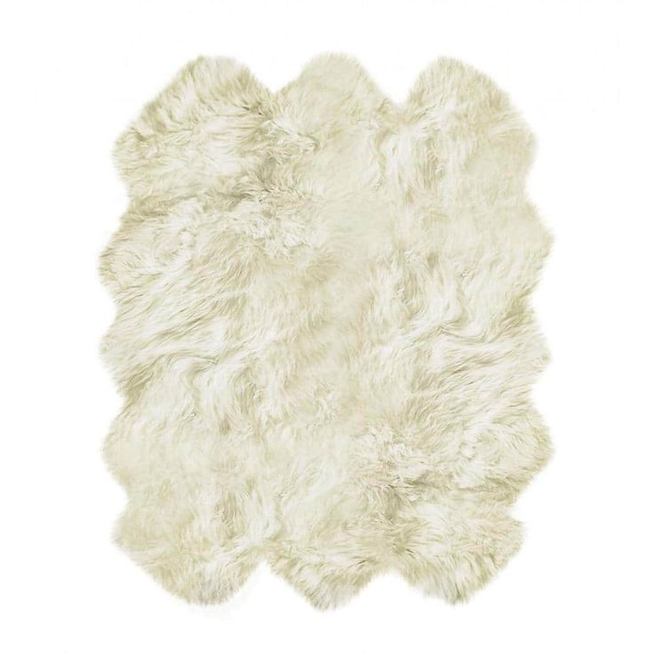 a white sheepskin rug on a white background