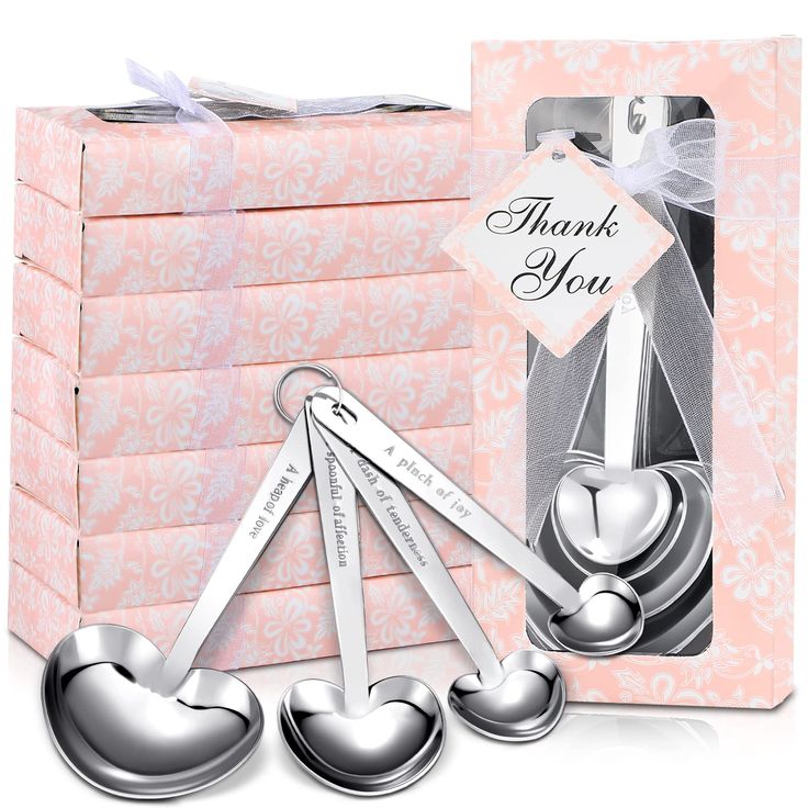 a set of four heart shaped measuring spoons in a gift box with a thank you tag