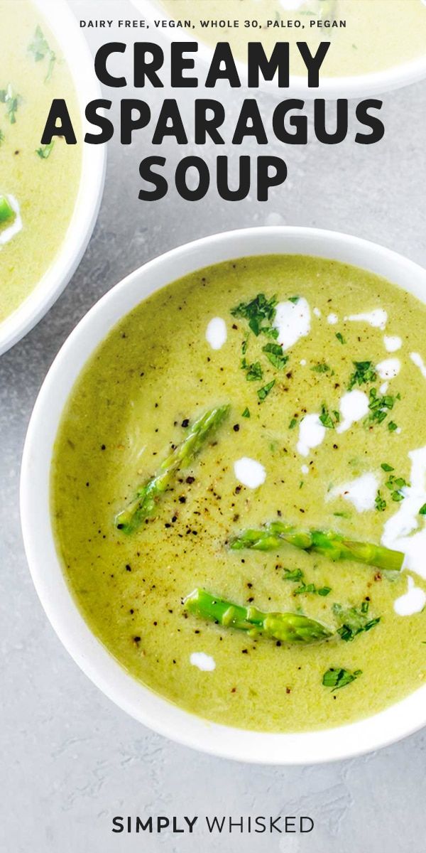 two bowls of creamy asparagus soup on a gray background with text overlay