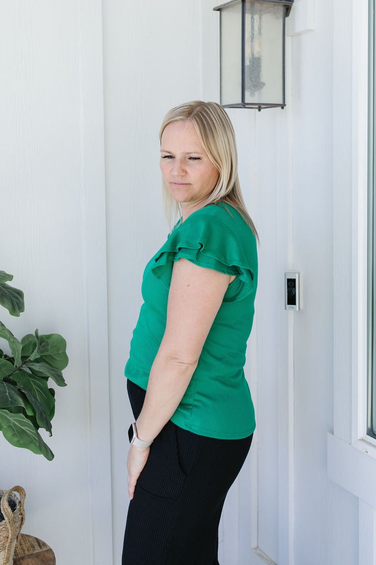 Experience the joy of wearing the Sophia Top! This emerald green solid shirt features ribbing for added texture, a round neck for comfort, and short flutter sleeves for a touch of playfulness. Perfect for everyday wear or dressing up for a night out. Model is wearing a large and is 5'5". Plus model is wearing a 1X and is 5'7". Size Chart Length Bust S 22.5" 32" M 23.5" 34" L 23.5" 36" 1x 26.5" 43" 2x 27" 46" 3x 27" 50" *All measurements are approximate and done while hanging.* Fabric and Care 92% Polyester 8% Spandex Hand wash cold separately, only non-chlorine bleach when needed, flat dry, warm iron if needed. Green Ruffle Sleeve Top For Spring, Green Short Sleeve Top For Everyday Spring Wear, Green Crew Neck Short Sleeve Top For Everyday, Green Short Sleeve T-shirt For Work, Solid Flutter Sleeve Tops For Day Out, Green Crew Neck Top For Day Out, Casual Fitted Green Short Sleeve Top, Green Ruffled Tops For Workwear, Trendy Kelly Green Tops For Spring