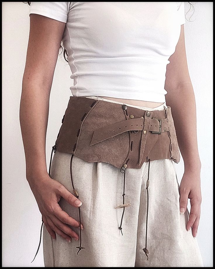 Leather corset belt, tribal leather belt, leather corset belt, nubuck festival belt, tribal belt, bohemian leather belt,barbrian belt and bag First of all, welcome! I would like to introduce a useful and ostentatious handmade nubuck leather set that has both sports and classic uses. Genuine leather and stainless metal accessories tanned by herbal methods are used in this belt and bag without using chemicals. Due to the fact that it takes a porous and breathable material   does not cause allergie Medieval Corset Belt For Larp With Belt Loops, Leather Steampunk Corset Belt For Festivals, Steampunk Leather Corset Belt For Festivals, Leather Corset Belt For Festivals, Medieval Style Corset Belt For Festivals, Medieval Corset Belt For Festivals, Brown Belt Bag For Festival, Brown Corset Belt For Festivals, Bohemian Belt Bag With Belt Loops For Festivals