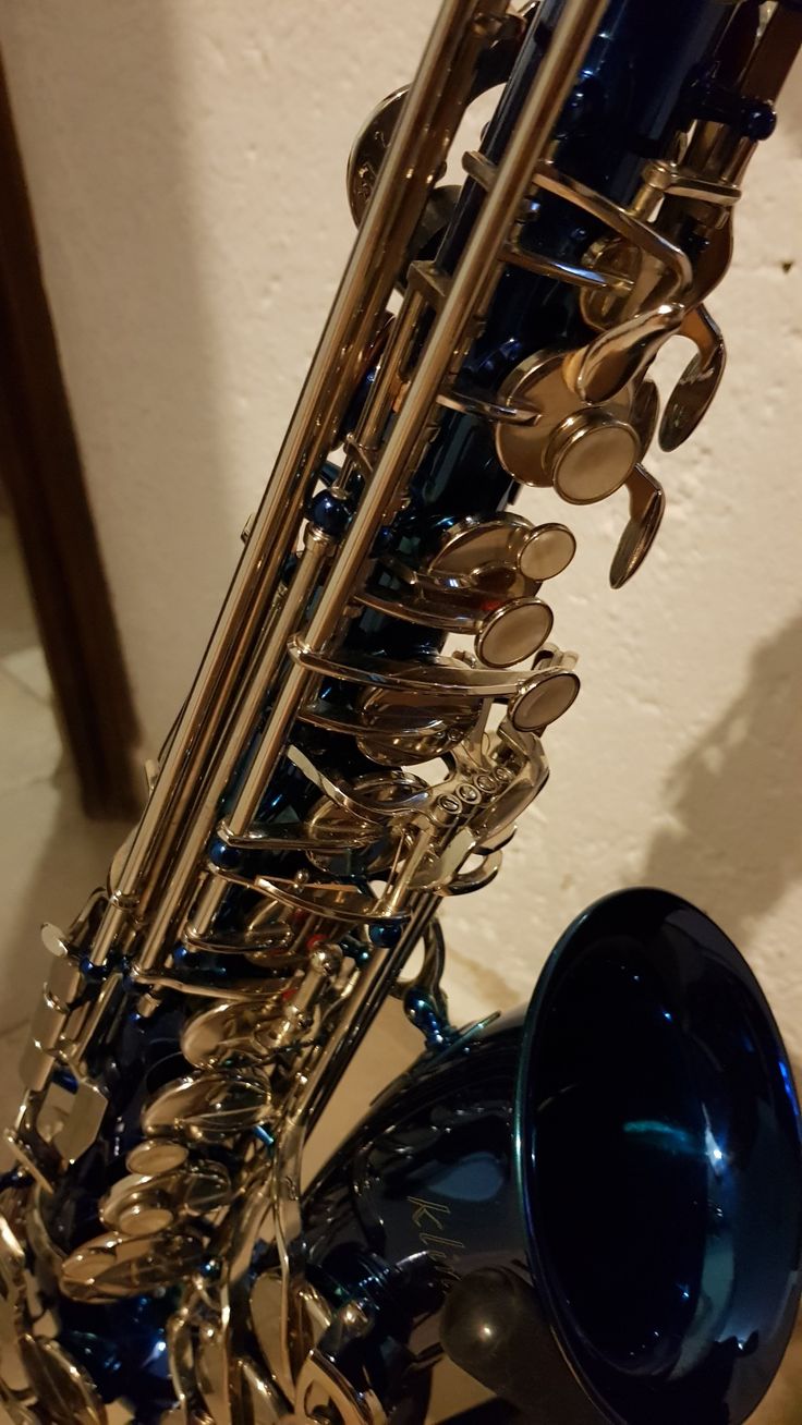 a close up of a saxophone on a table