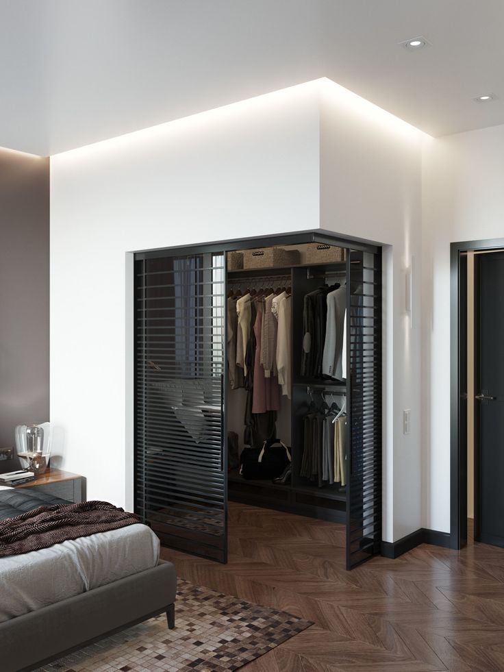 an open closet in the corner of a bedroom