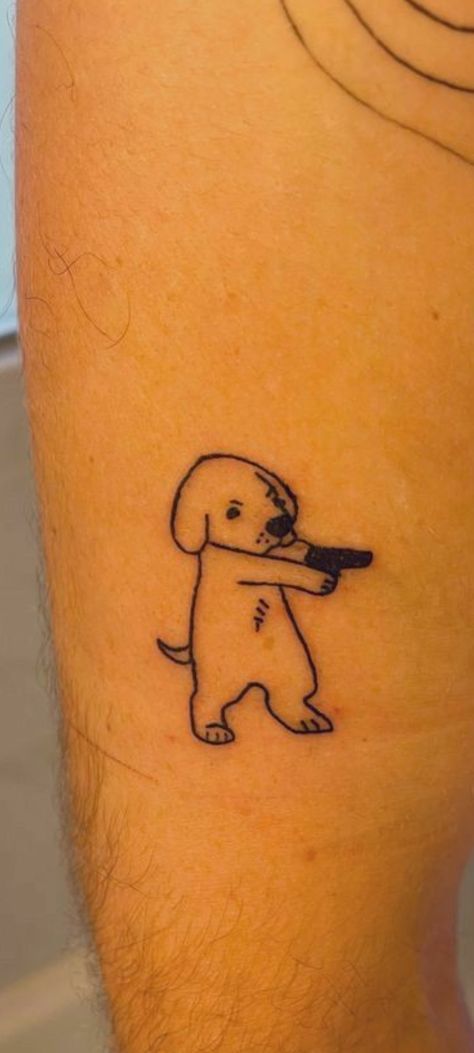 a man with a dog tattoo on his leg