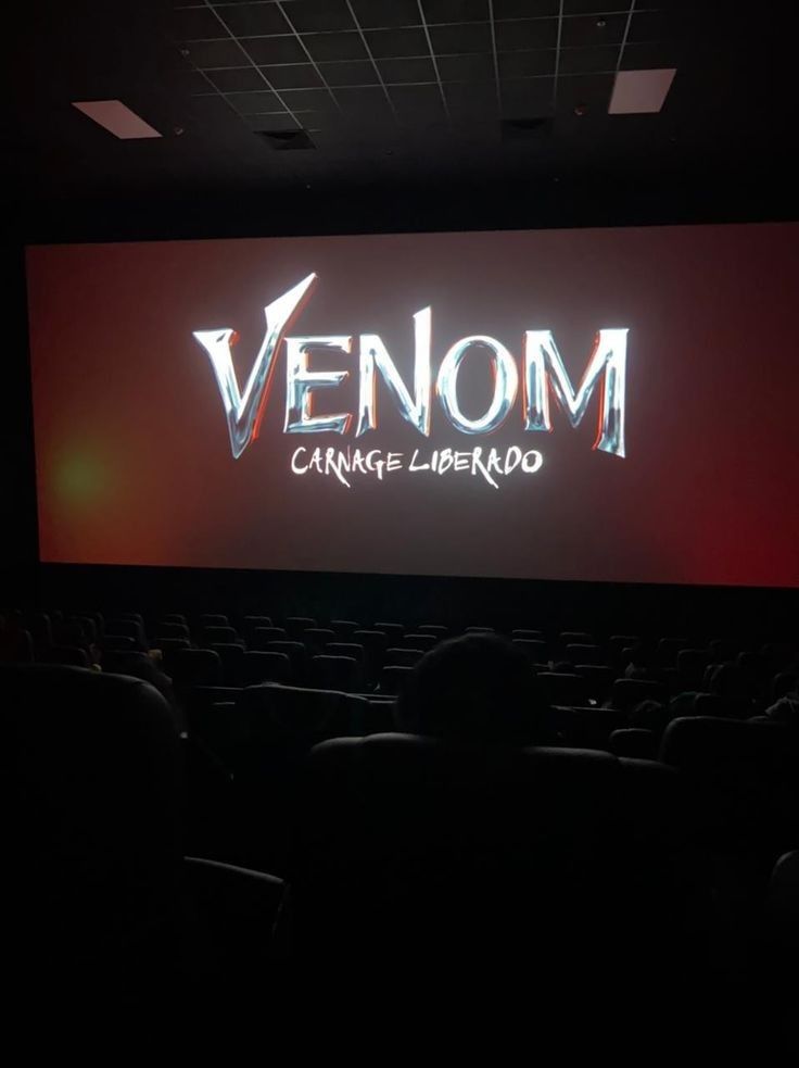 an empty theater with the words venom lit up