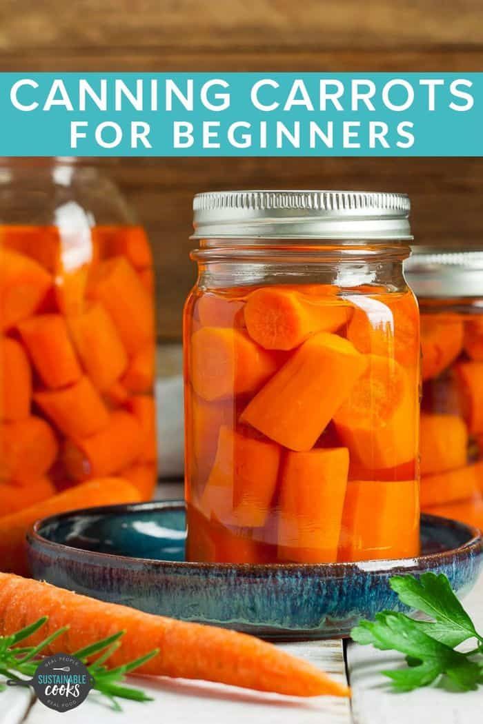 jars filled with carrots sitting on top of a table